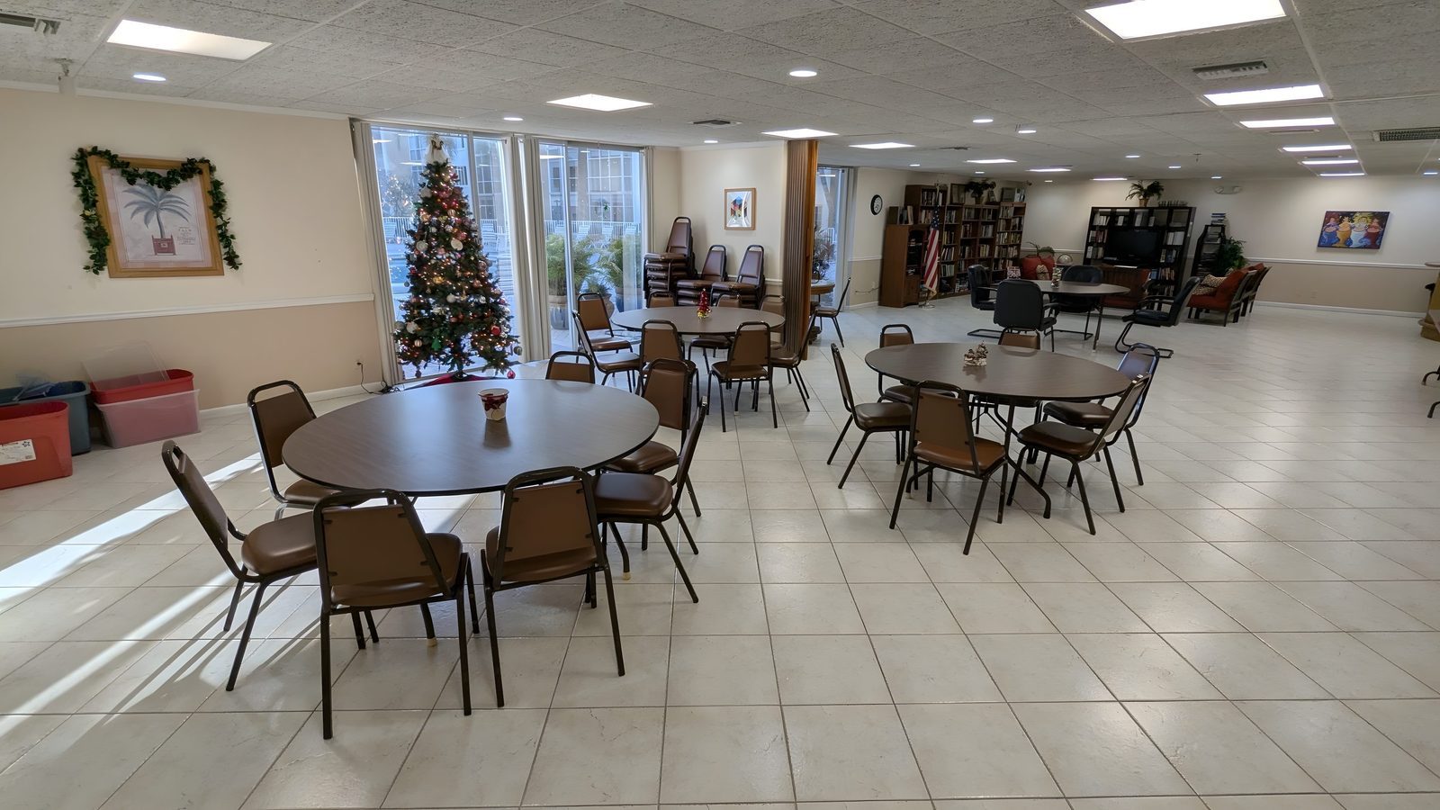 The clubhouse room with tables and chairs.