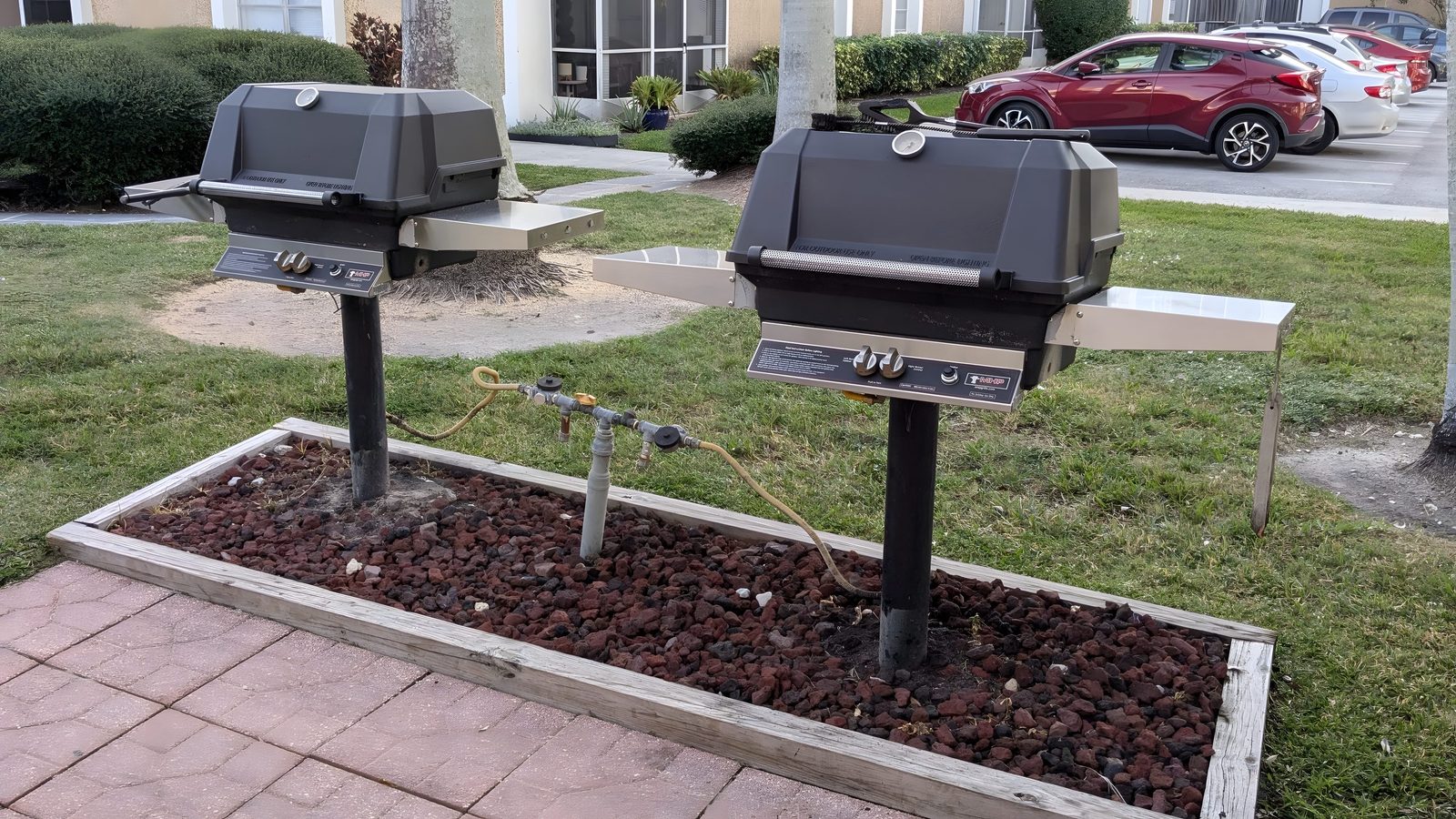 Barbeque grills on the lawn.